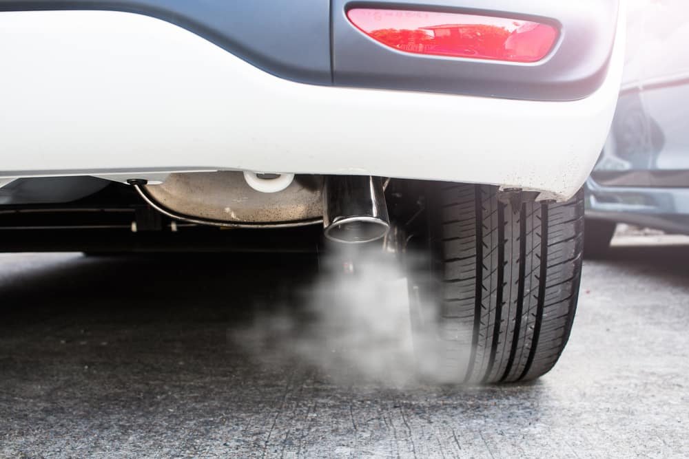 Pipe-exhaust-with-a-smoking-car